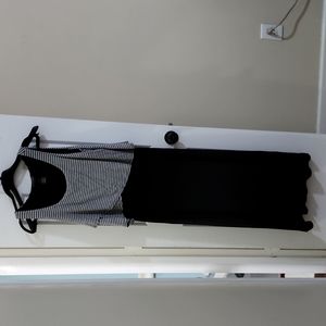 Long black and gray dress that flairs at the bottom